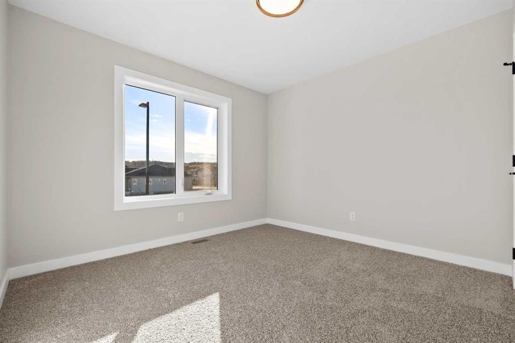 85 Quartz Crescent, Cochrane, AB - Indoor Photo Showing Other Room