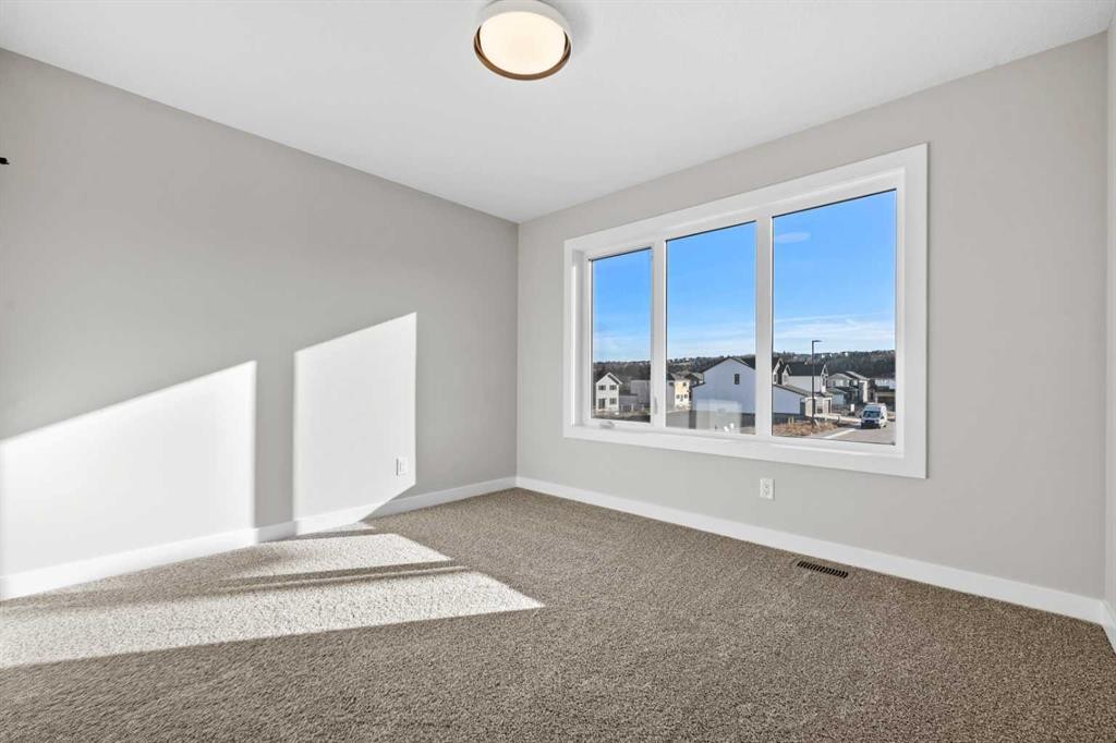 85 Quartz Crescent, Cochrane, AB - Indoor Photo Showing Other Room