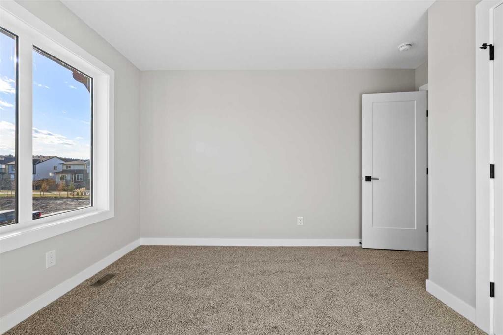 85 Quartz Crescent, Cochrane, AB - Indoor Photo Showing Other Room