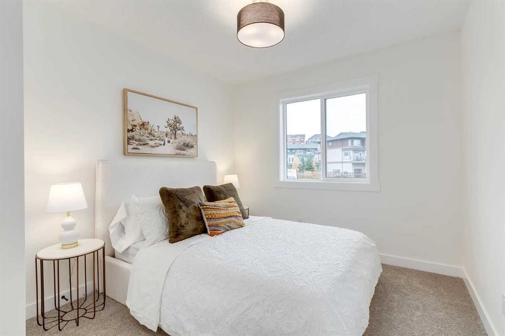 1507-525 River Heights Drive, Cochrane, AB - Indoor Photo Showing Bedroom