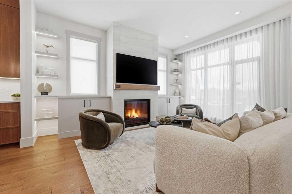 749 Serenity Bend, Heritage Pointe, AB - Indoor Photo Showing Living Room With Fireplace