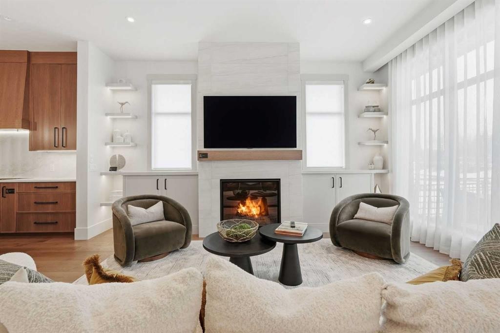 749 Serenity Bend, Heritage Pointe, AB - Indoor Photo Showing Living Room With Fireplace