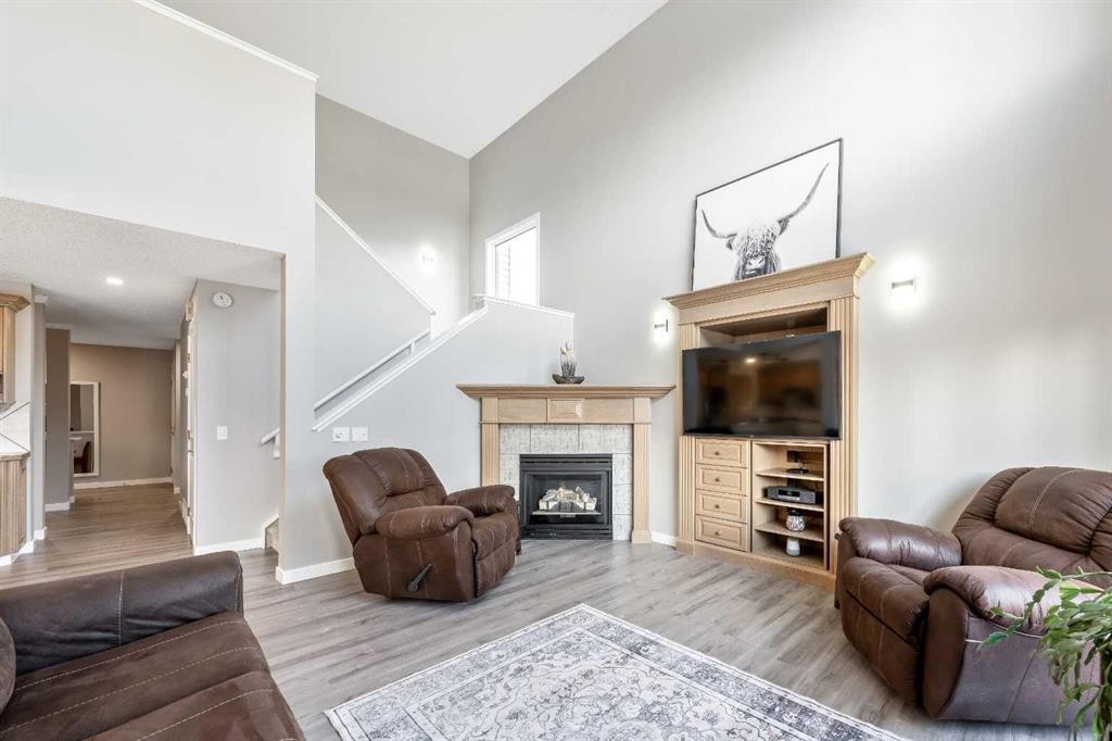9 Hidden Valley Crescent Nw, Calgary, AB - Indoor Photo Showing Living Room With Fireplace