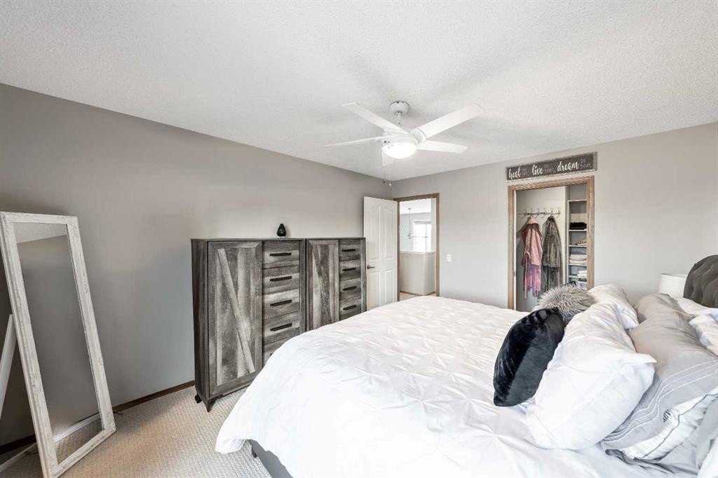 9 Hidden Valley Crescent Nw, Calgary, AB - Indoor Photo Showing Bedroom