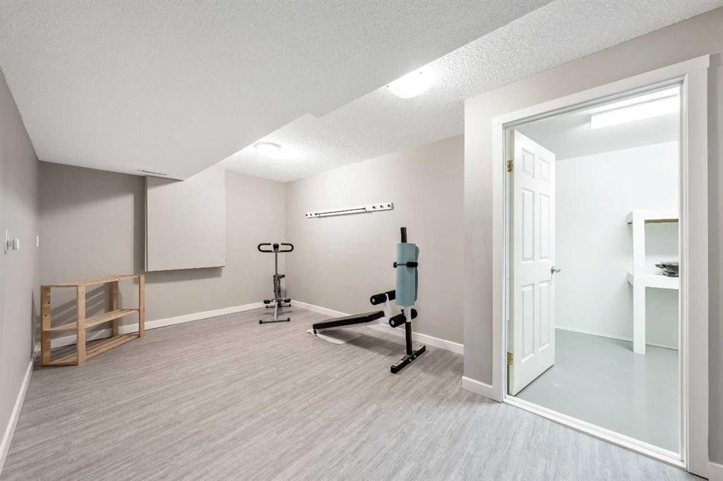 9 Hidden Valley Crescent Nw, Calgary, AB - Indoor Photo Showing Gym Room