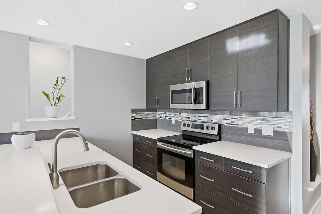 105 Chaparral Valley Crescent Se, Calgary, AB - Indoor Photo Showing Kitchen With Double Sink With Upgraded Kitchen