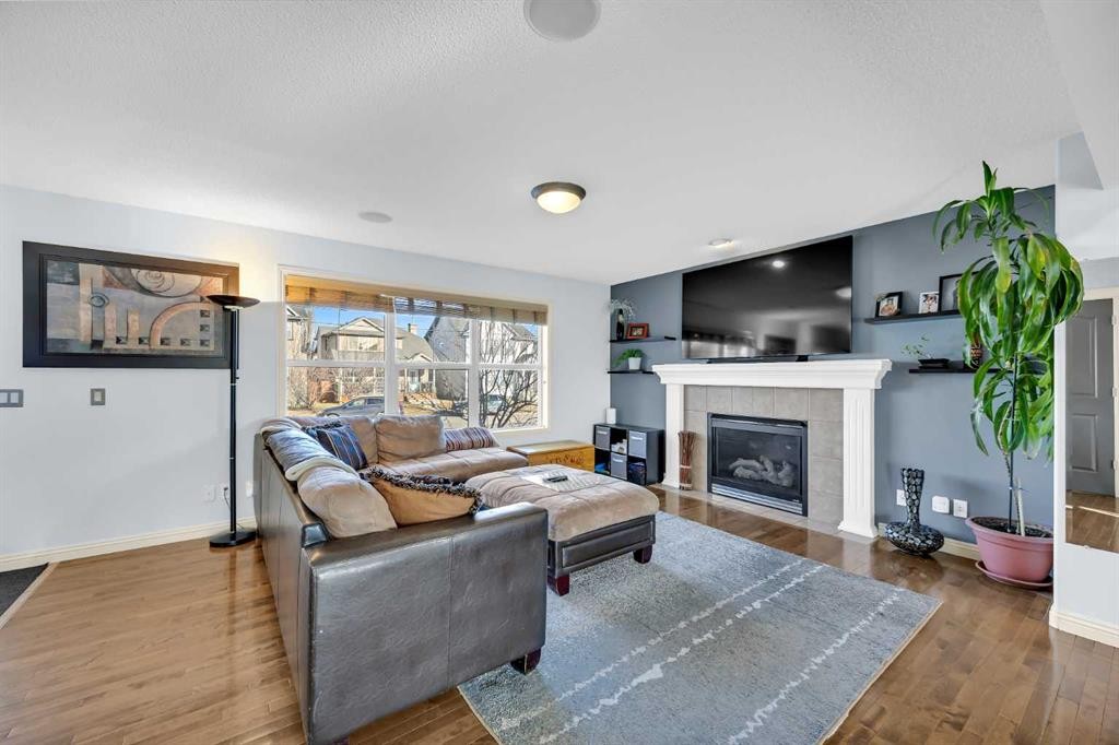 139 Prestwick Point Se, Calgary, AB - Indoor Photo Showing Living Room With Fireplace