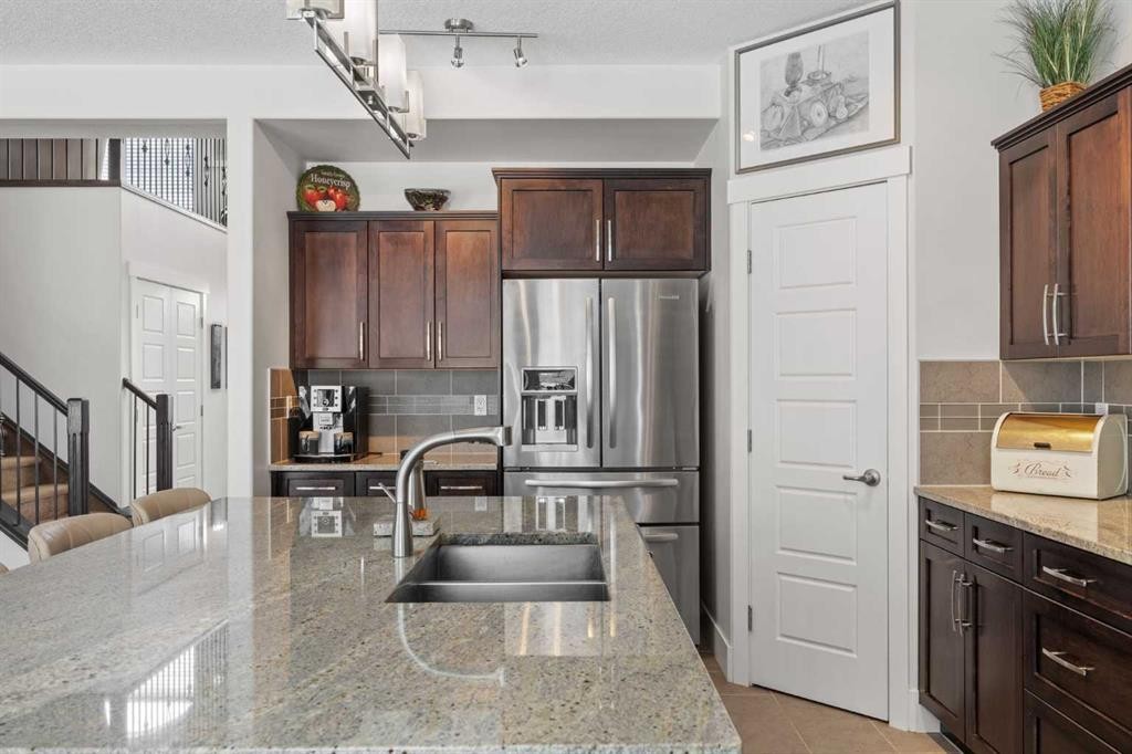 184 Magenta Crescent, Chestermere, AB - Indoor Photo Showing Kitchen With Double Sink With Upgraded Kitchen