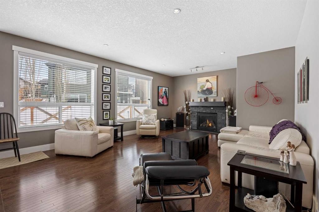 184 Magenta Crescent, Chestermere, AB - Indoor Photo Showing Living Room With Fireplace