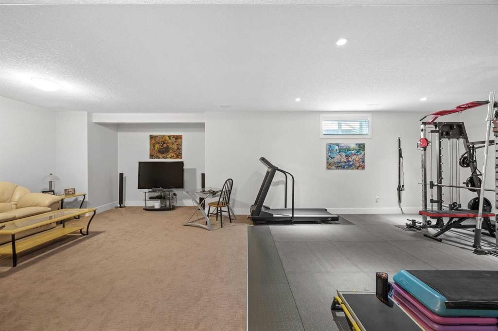 184 Magenta Crescent, Chestermere, AB - Indoor Photo Showing Gym Room