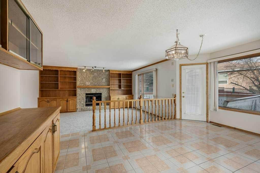 106 Sienna Hills Drive Sw, Calgary, AB - Indoor Photo Showing Other Room With Fireplace
