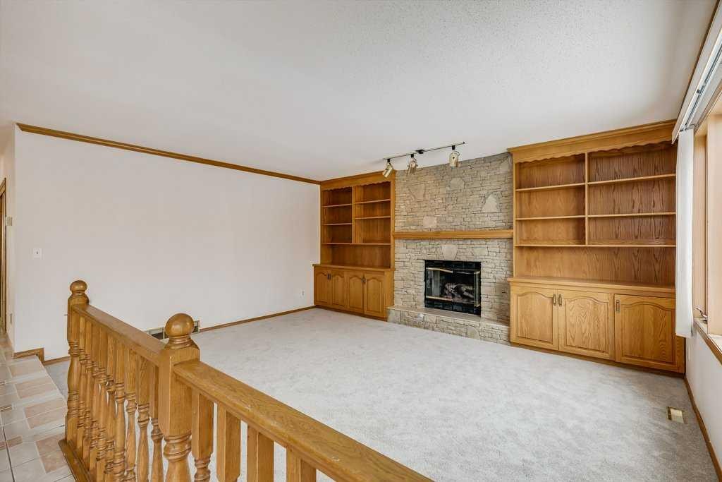 106 Sienna Hills Drive Sw, Calgary, AB - Indoor Photo Showing Other Room With Fireplace