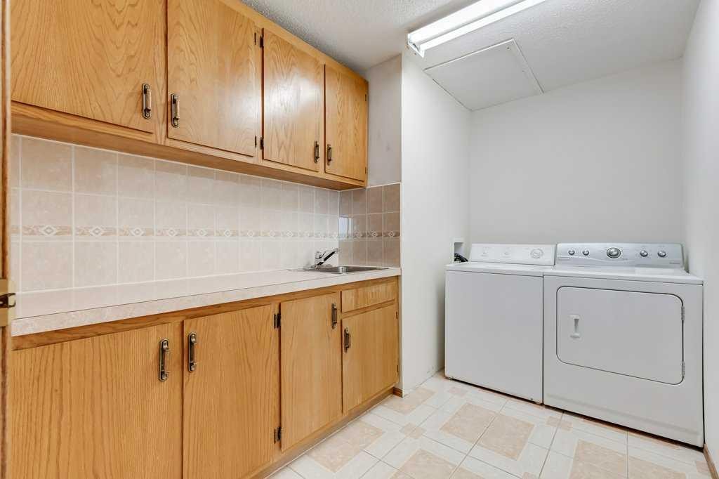 106 Sienna Hills Drive Sw, Calgary, AB - Indoor Photo Showing Laundry Room