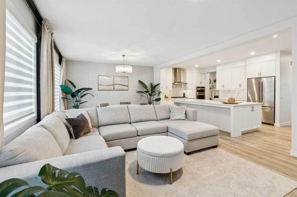 153 Edith Villas Nw, Calgary, AB - Indoor Photo Showing Living Room