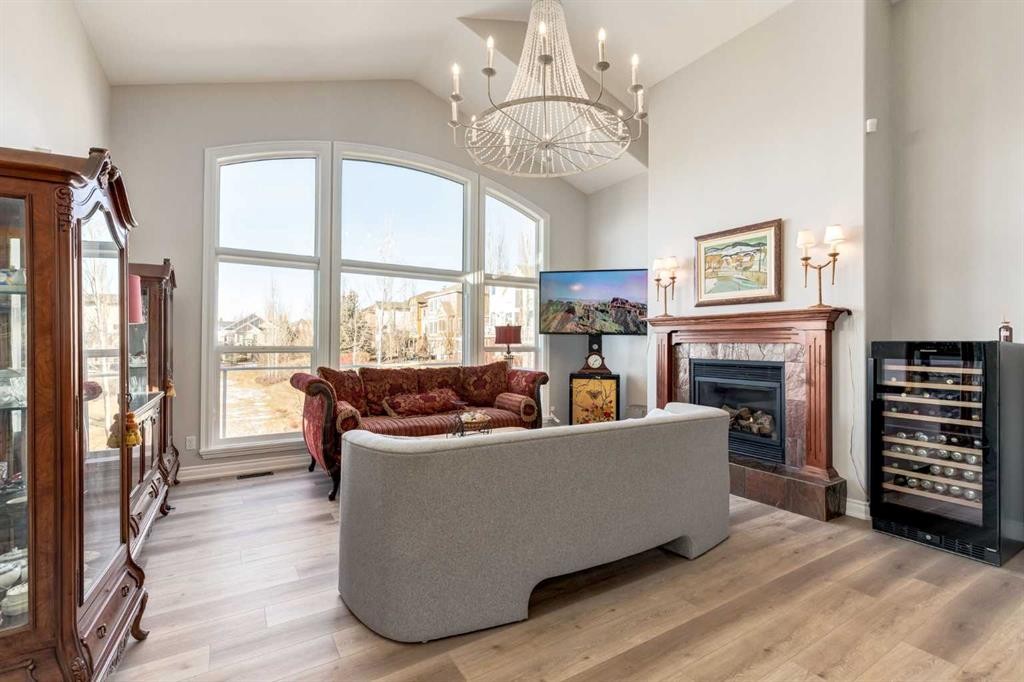 79 Discovery Ridge Park Sw, Calgary, AB - Indoor Photo Showing Living Room With Fireplace