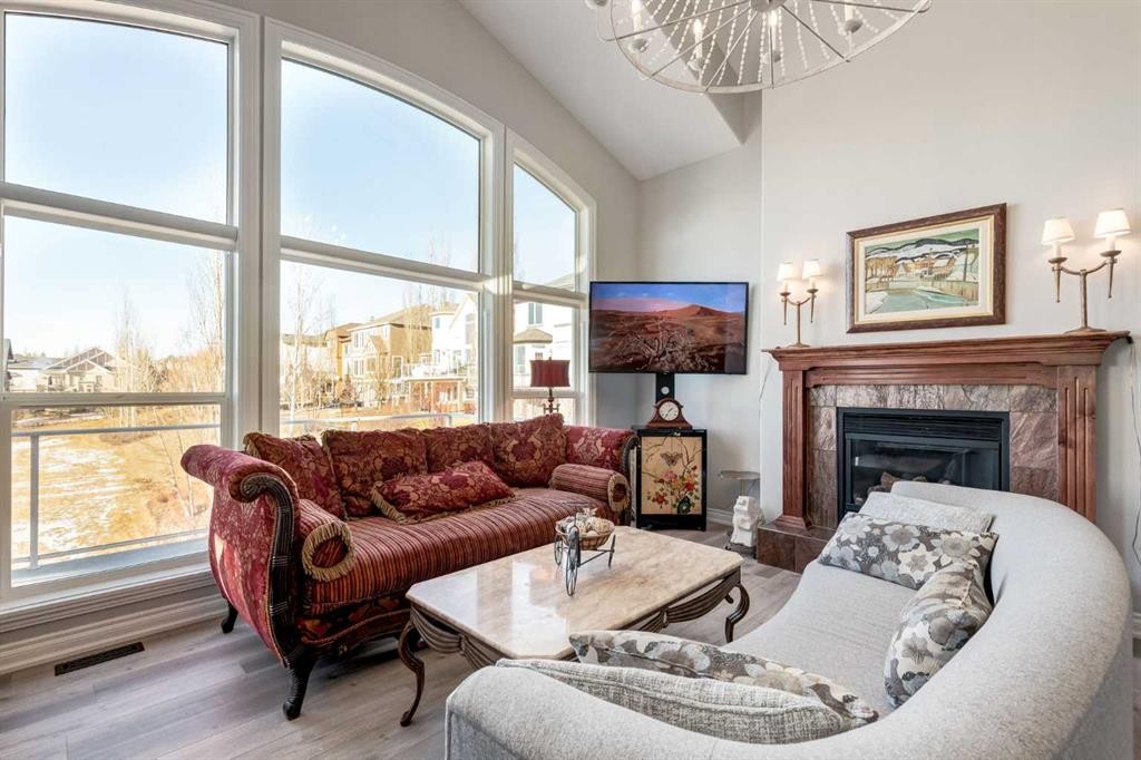 79 Discovery Ridge Park Sw, Calgary, AB - Indoor Photo Showing Living Room With Fireplace