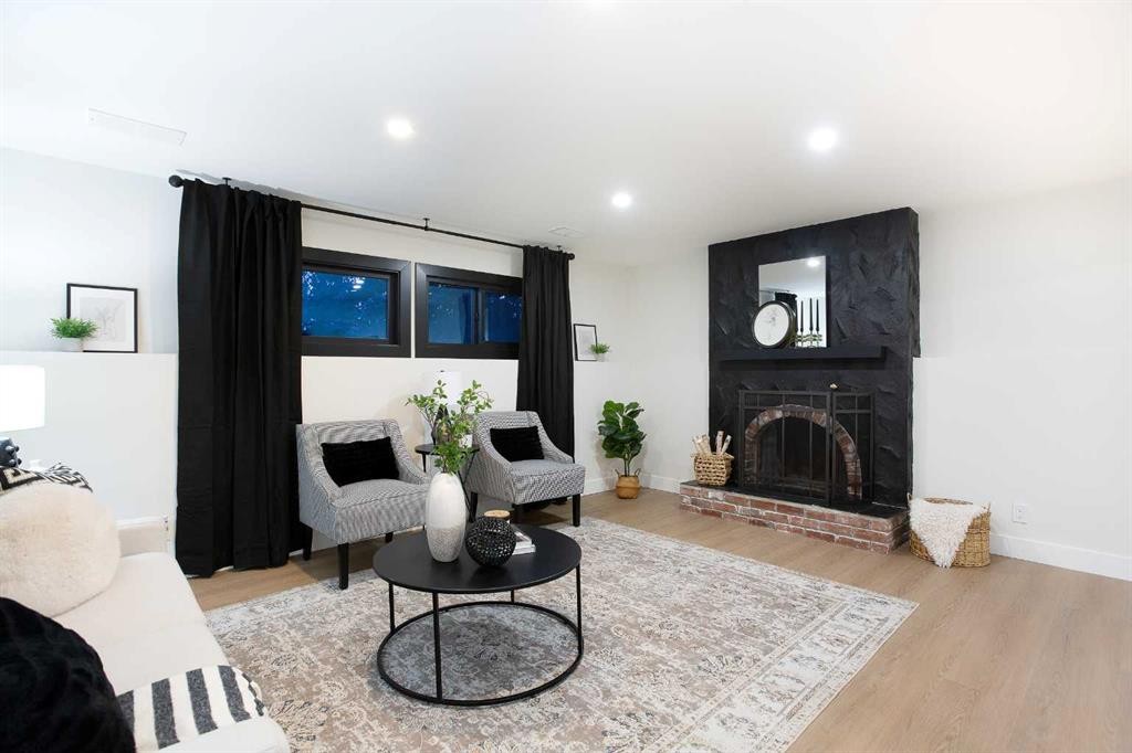 2416 Palliser Drive Sw, Calgary, AB - Indoor Photo Showing Living Room With Fireplace