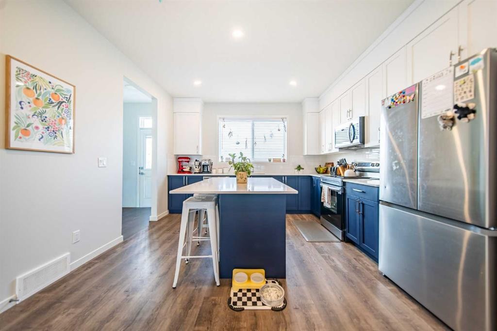 27 Iris Crescent, Okotoks, AB - Indoor Photo Showing Kitchen With Stainless Steel Kitchen With Upgraded Kitchen