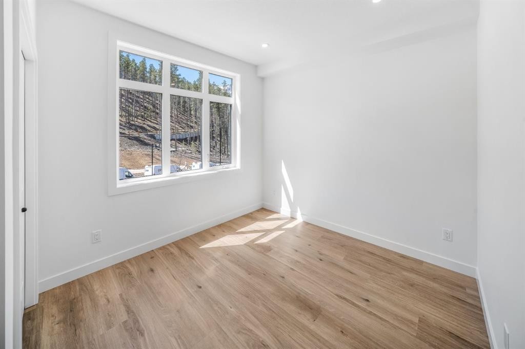 205-10 Cascade Ridge, Canmore, AB - Indoor Photo Showing Other Room