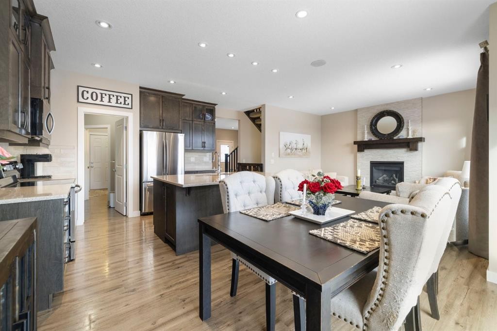 8 Emberside Glen, Cochrane, AB - Indoor With Fireplace