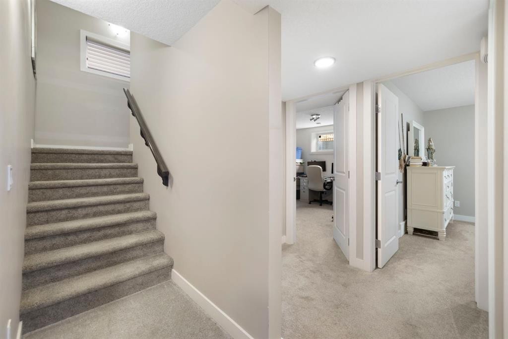 8 Emberside Glen, Cochrane, AB - Indoor Photo Showing Other Room