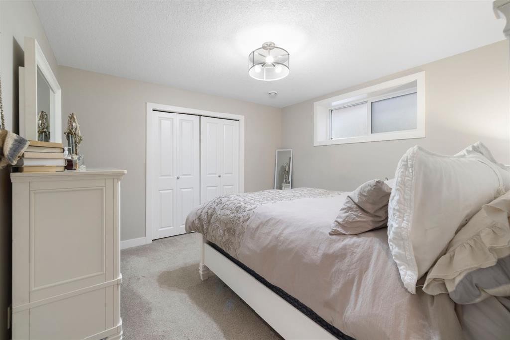 8 Emberside Glen, Cochrane, AB - Indoor Photo Showing Bedroom