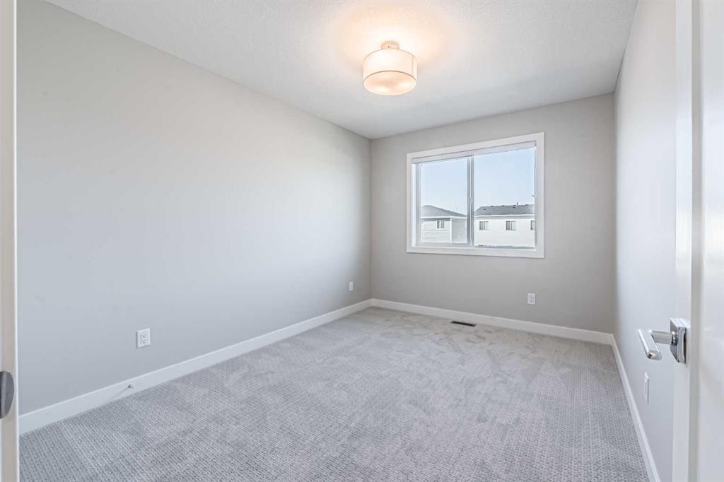 129 Dawson Wharf View, Chestermere, AB - Indoor Photo Showing Other Room