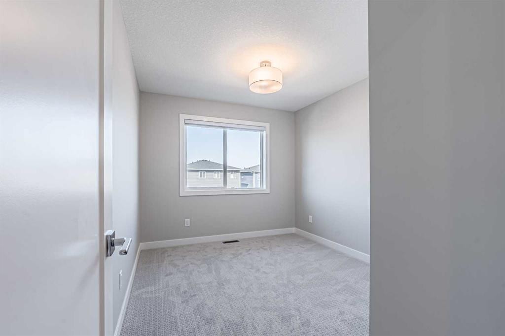 129 Dawson Wharf View, Chestermere, AB - Indoor Photo Showing Other Room