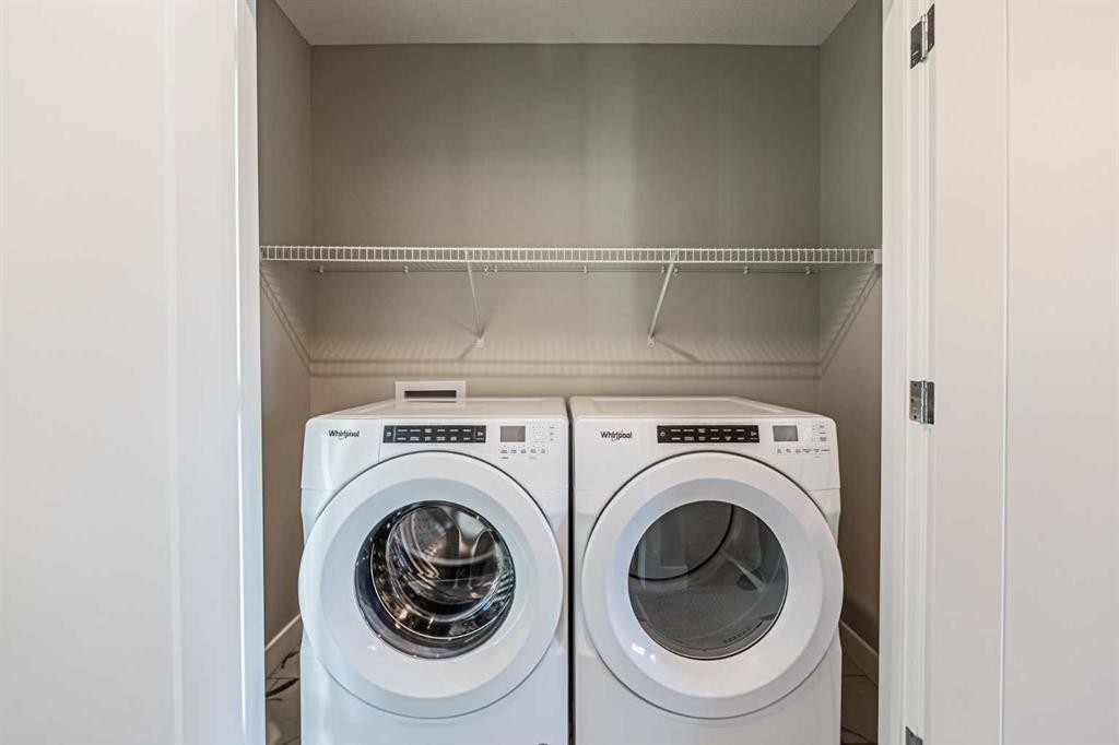 129 Dawson Wharf View, Chestermere, AB - Indoor Photo Showing Laundry Room