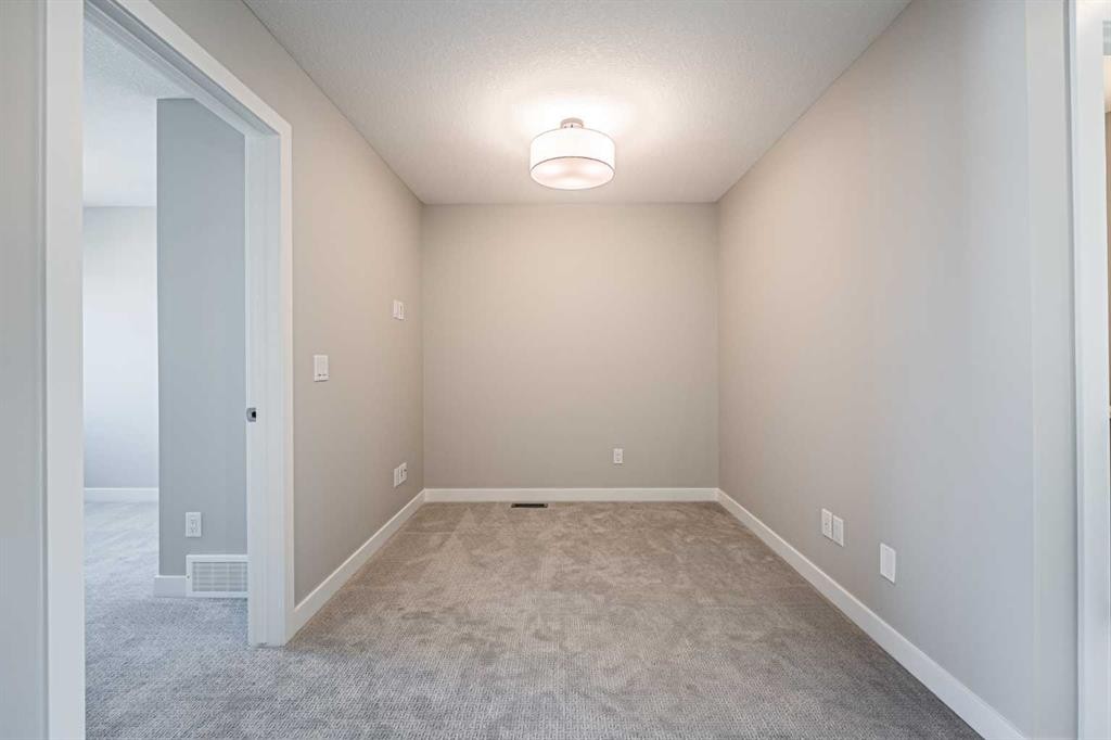 129 Dawson Wharf View, Chestermere, AB - Indoor Photo Showing Other Room