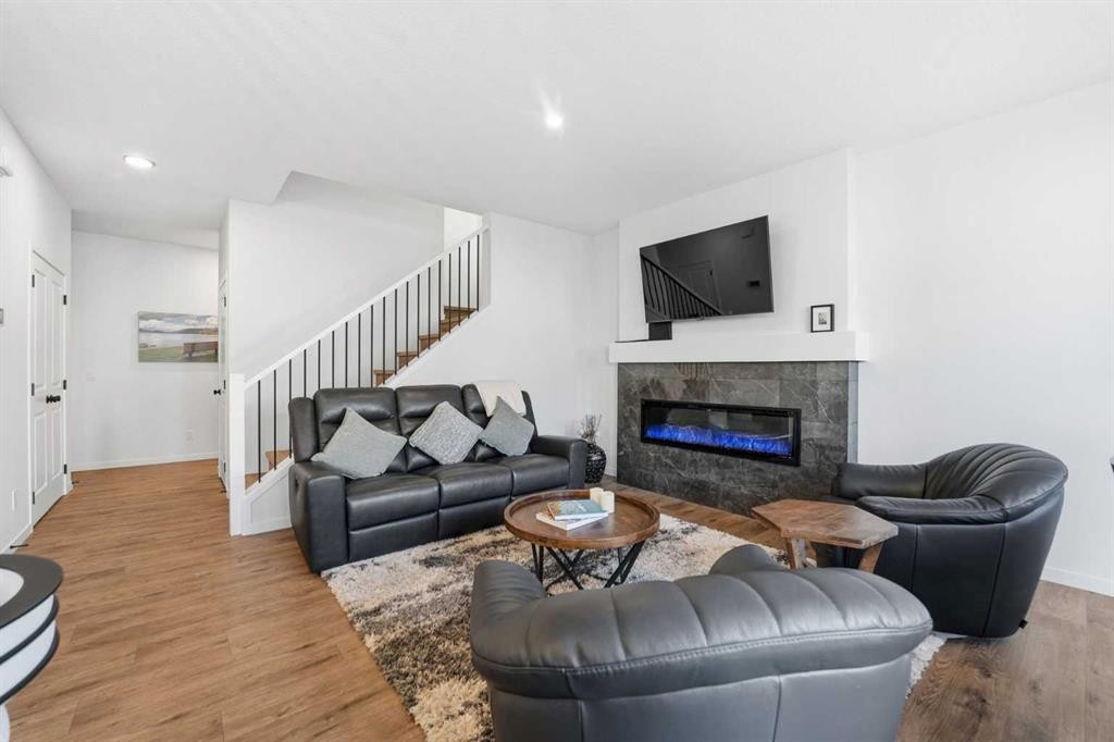 102 Setonstone Manor Se, Calgary, AB - Indoor Photo Showing Living Room With Fireplace