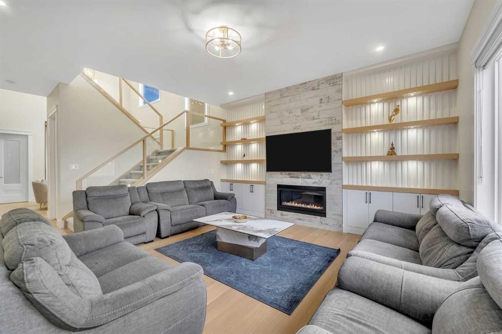 2012 Waterbury Road, Chestermere, AB - Indoor Photo Showing Living Room With Fireplace