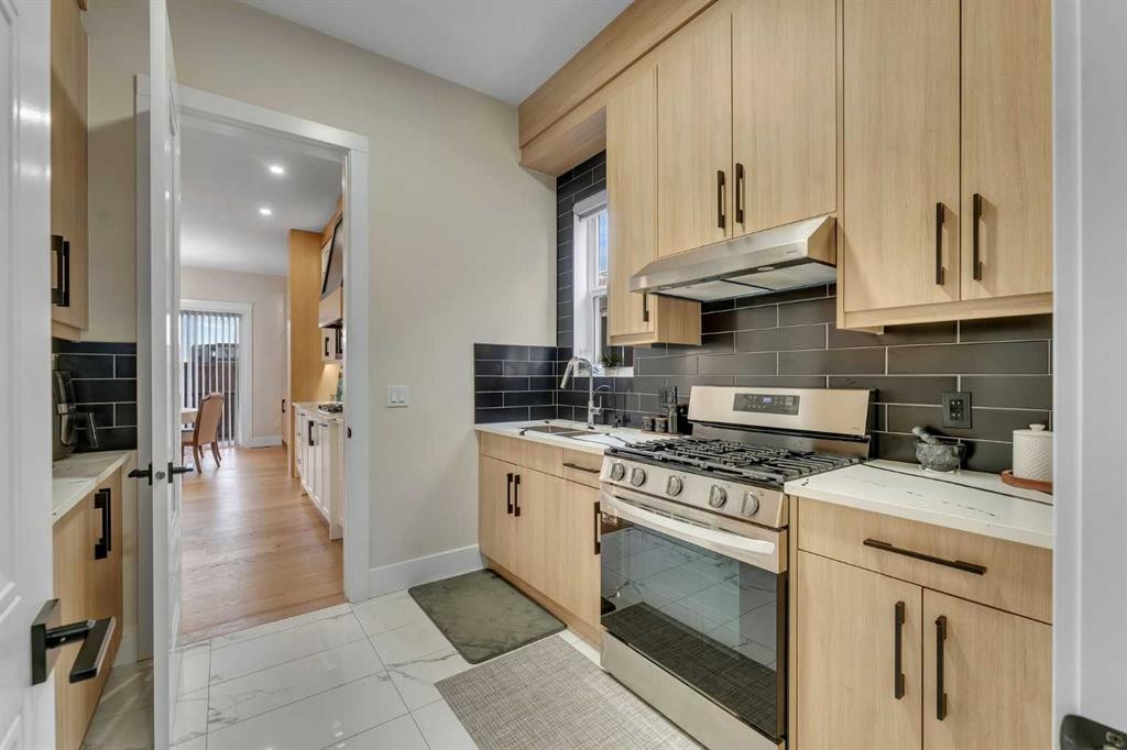 2012 Waterbury Road, Chestermere, AB - Indoor Photo Showing Kitchen With Upgraded Kitchen