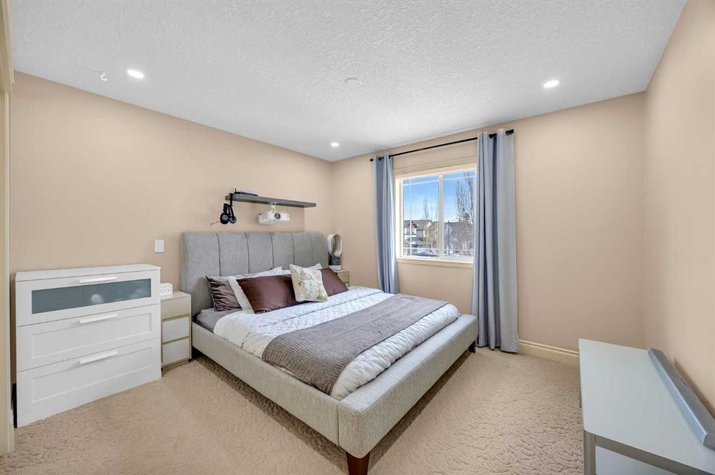 100 Cougarstone Manor Sw, Calgary, AB - Indoor Photo Showing Bedroom