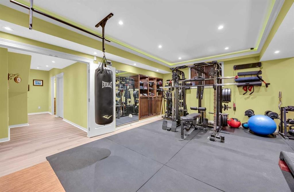 100 Cougarstone Manor Sw, Calgary, AB - Indoor Photo Showing Gym Room