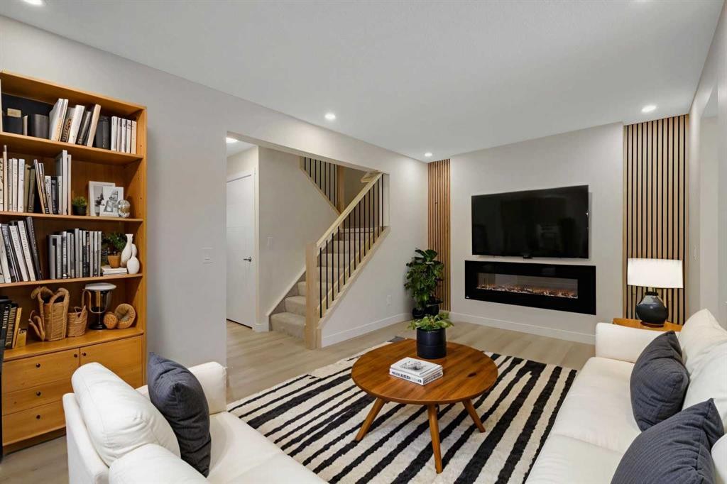 13 Penworth Close Se, Calgary, AB - Indoor Photo Showing Living Room With Fireplace