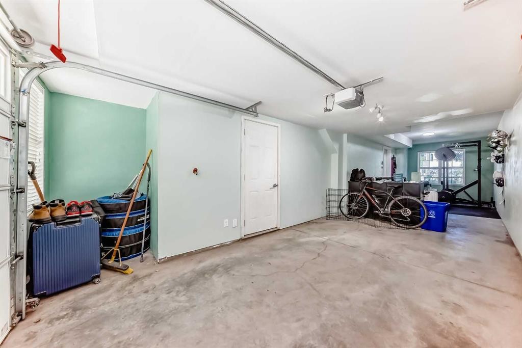 84 Sherwood Row Nw, Calgary, AB - Indoor Photo Showing Garage