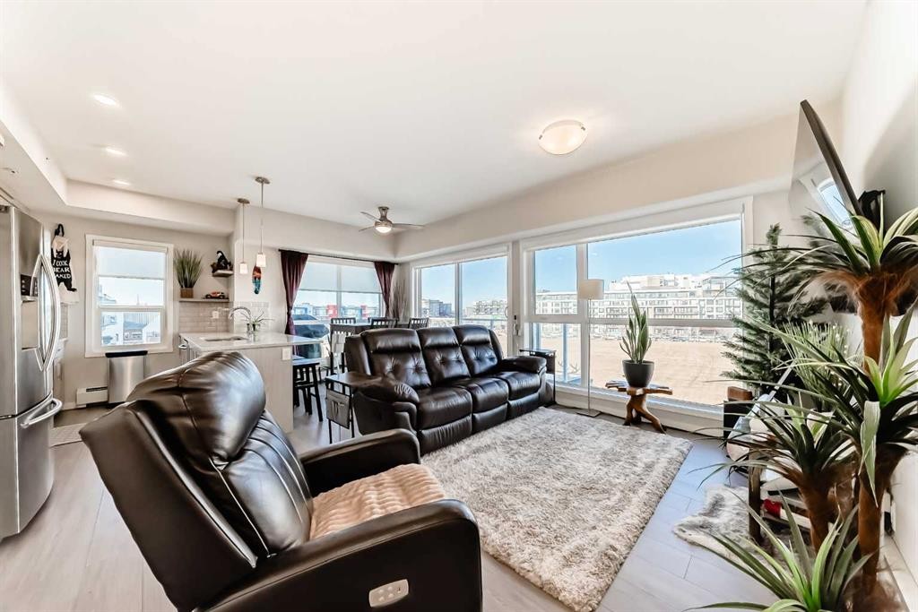 409-4150 Seton Drive Se, Calgary, AB - Indoor Photo Showing Living Room