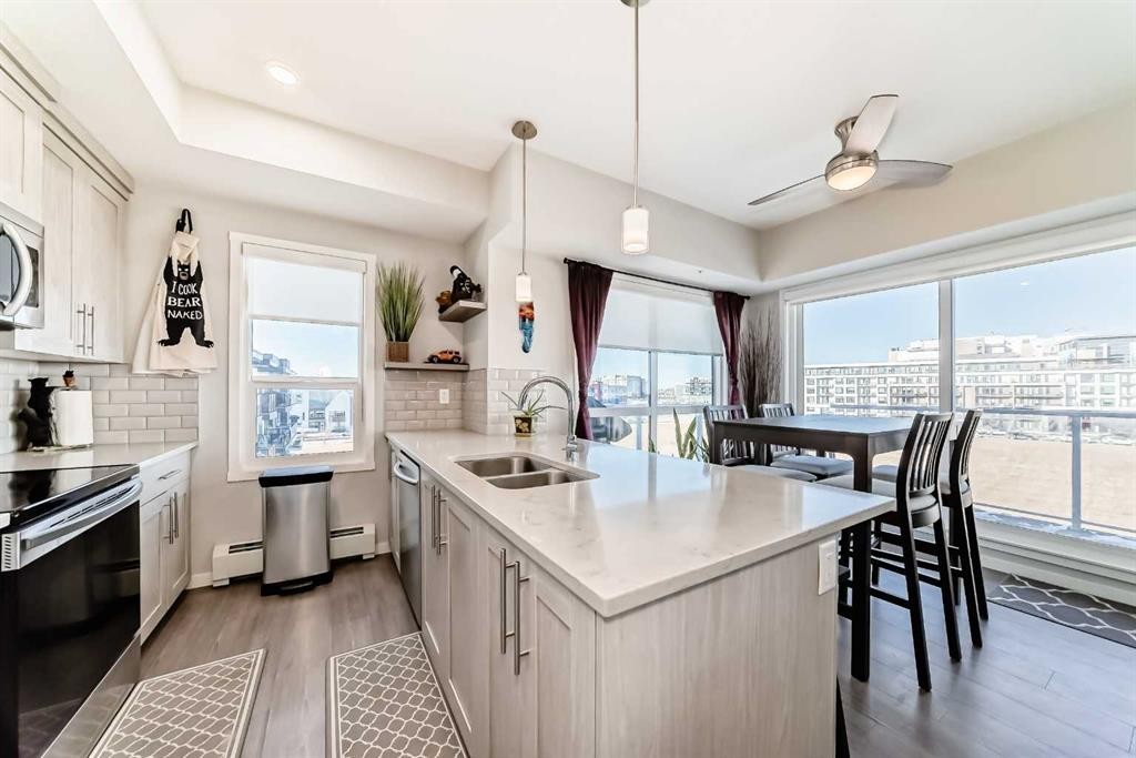 409-4150 Seton Drive Se, Calgary, AB - Indoor Photo Showing Kitchen With Double Sink With Upgraded Kitchen