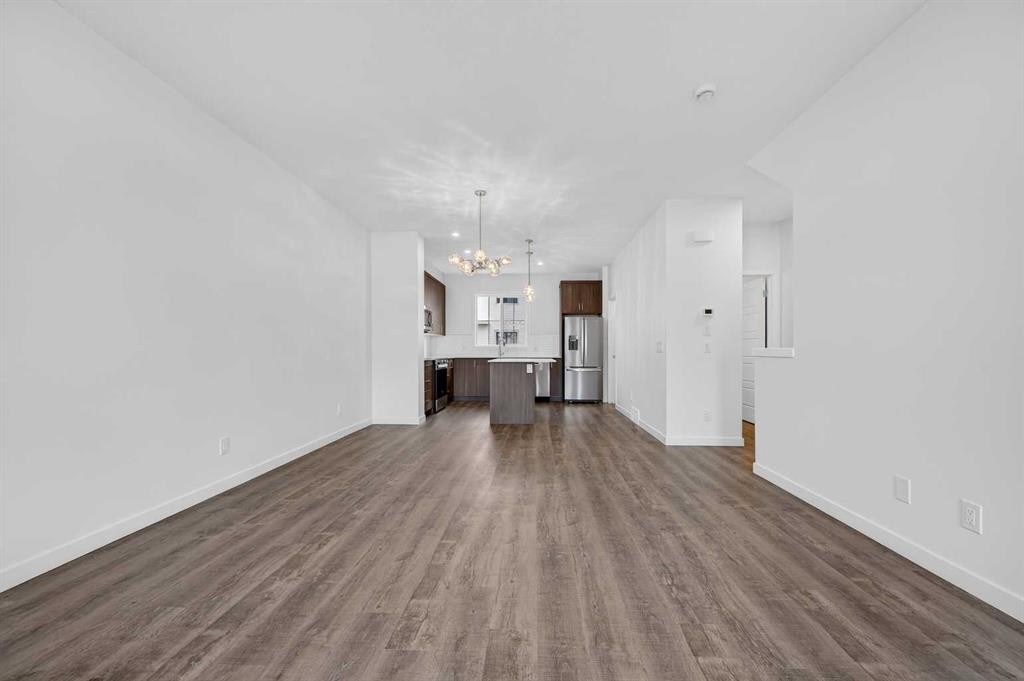 56 Creekside Drive Sw, Calgary, AB - Indoor Photo Showing Other Room