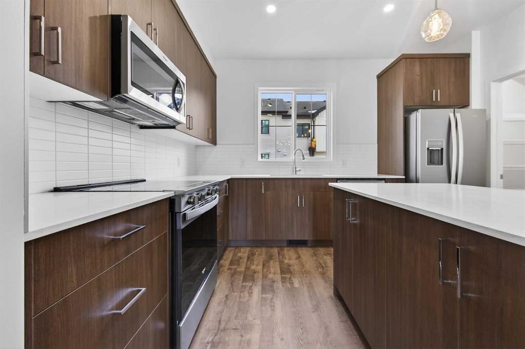 56 Creekside Drive Sw, Calgary, AB - Indoor Photo Showing Kitchen With Stainless Steel Kitchen With Upgraded Kitchen