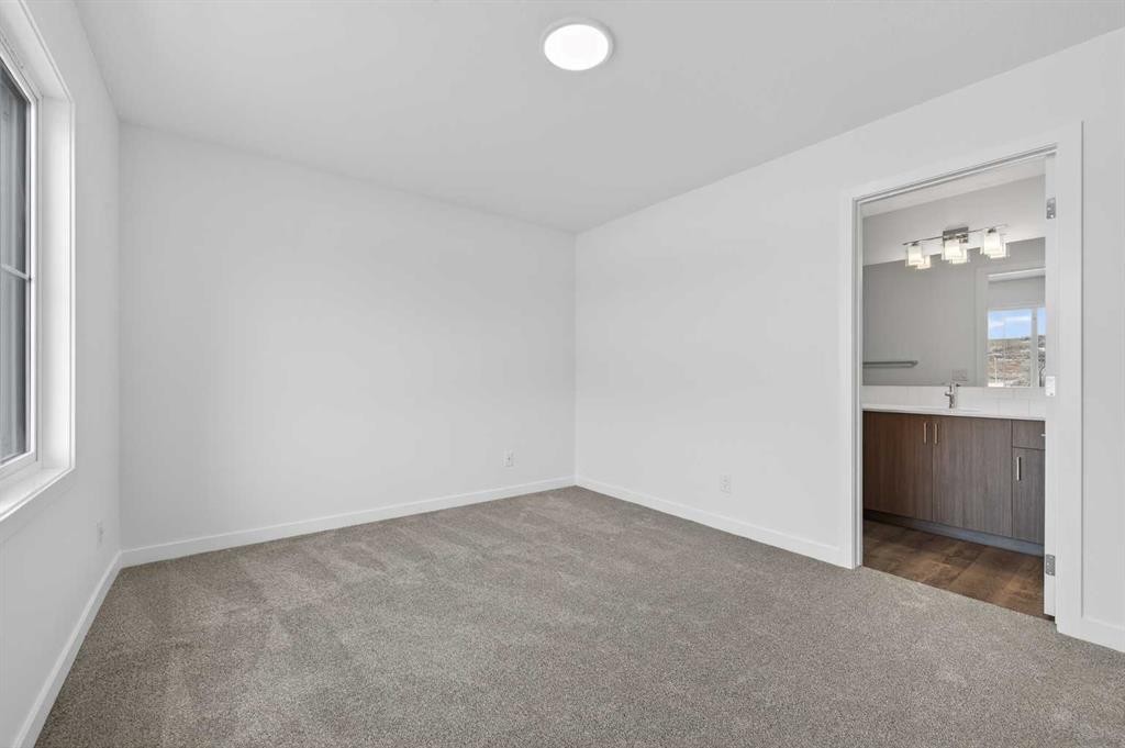 56 Creekside Drive Sw, Calgary, AB - Indoor Photo Showing Other Room