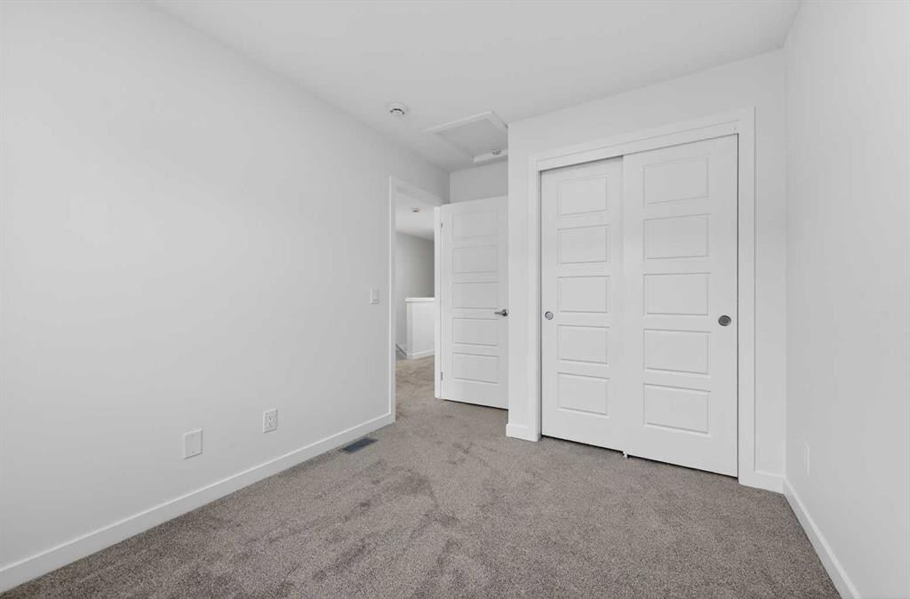 56 Creekside Drive Sw, Calgary, AB - Indoor Photo Showing Other Room