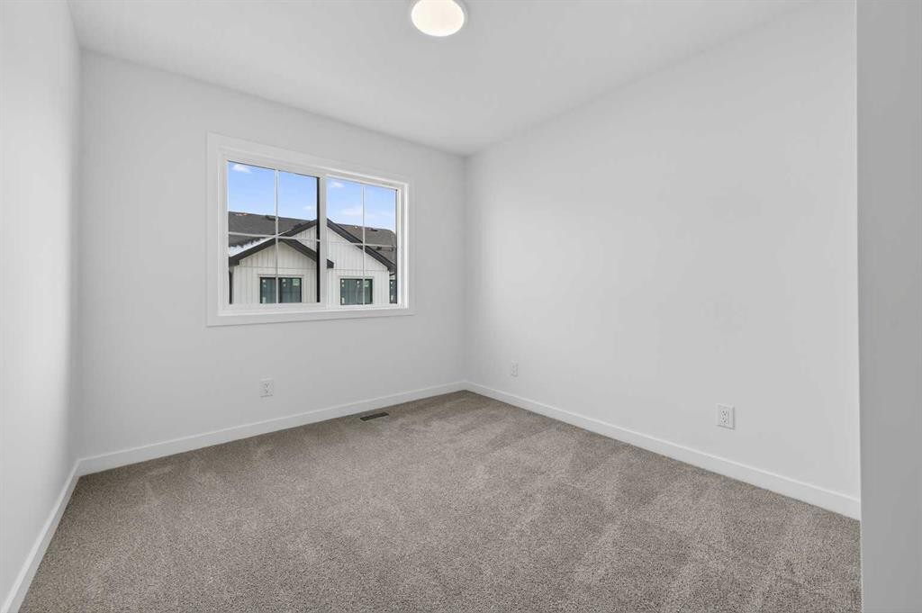 56 Creekside Drive Sw, Calgary, AB - Indoor Photo Showing Other Room
