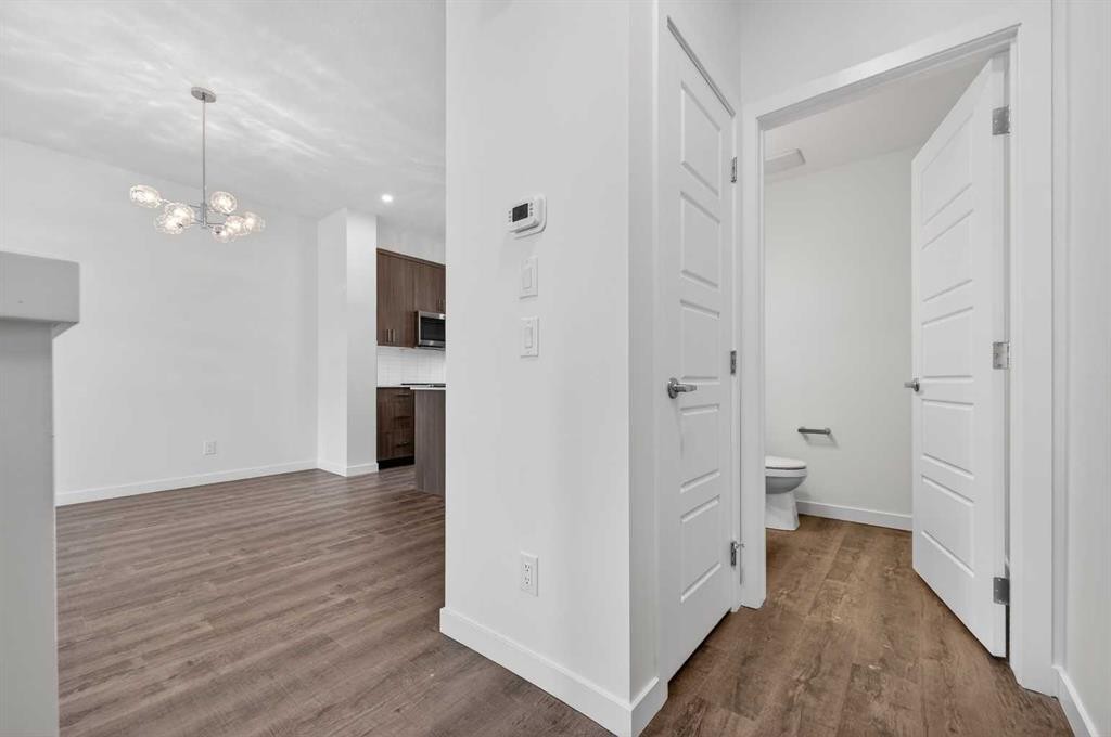 56 Creekside Drive Sw, Calgary, AB - Indoor Photo Showing Other Room