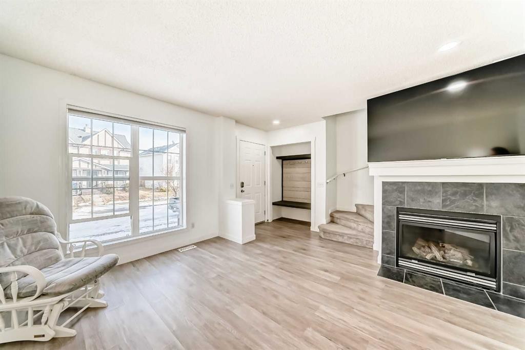 294 Elgin View Se, Calgary, AB - Indoor Photo Showing Living Room With Fireplace