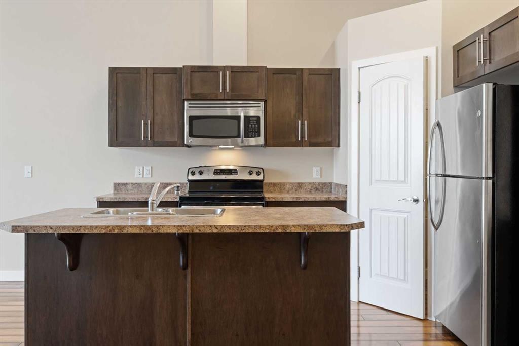 2203-230 Eversyde Boulevard Sw, Calgary, AB - Indoor Photo Showing Kitchen With Stainless Steel Kitchen With Double Sink