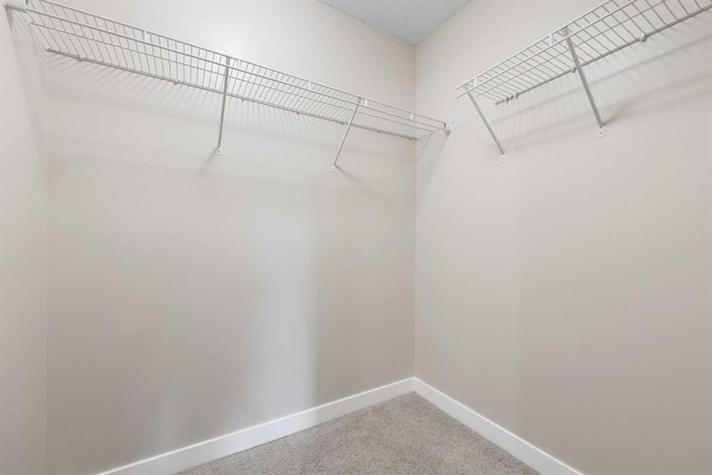 2203-230 Eversyde Boulevard Sw, Calgary, AB - Indoor With Storage