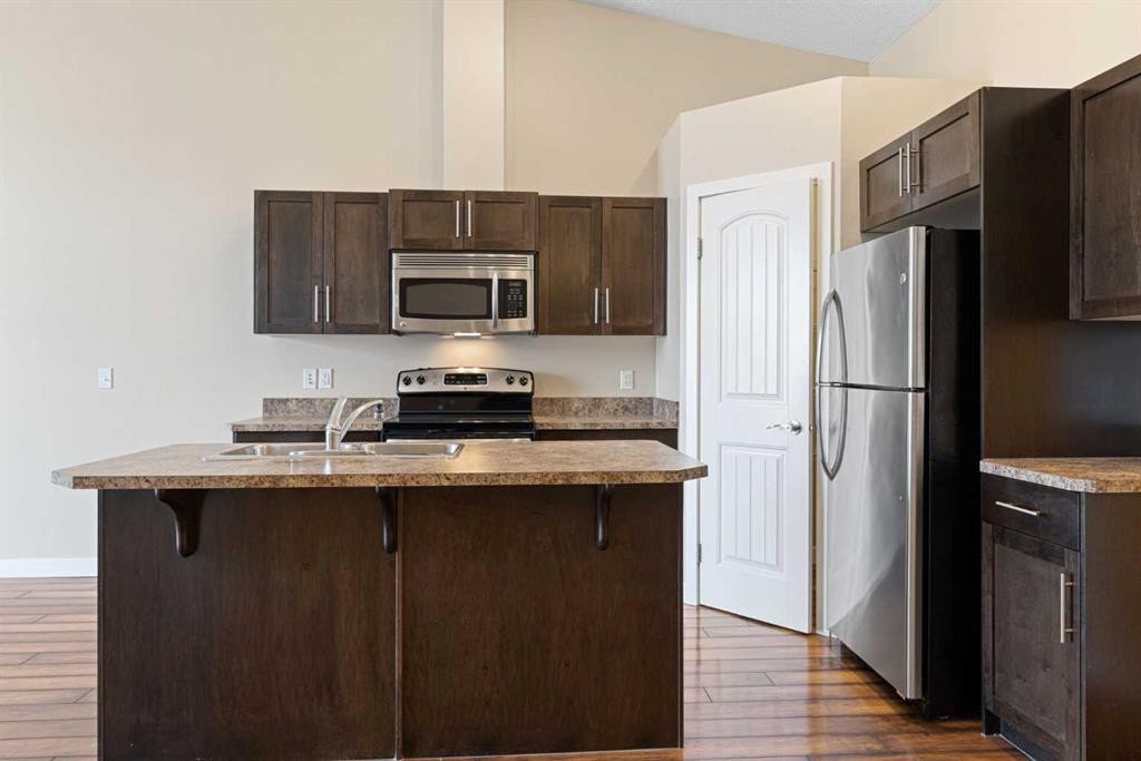 2203-230 Eversyde Boulevard Sw, Calgary, AB - Indoor Photo Showing Kitchen With Stainless Steel Kitchen