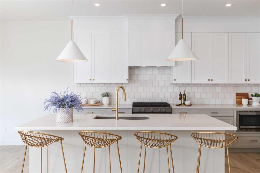 47 Sundown Crescent, Cochrane, AB - Indoor Photo Showing Kitchen With Upgraded Kitchen